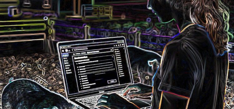 Intern on laptop with pigs in the background